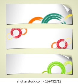 set of three white banners with curled corner and circles colored for spring 