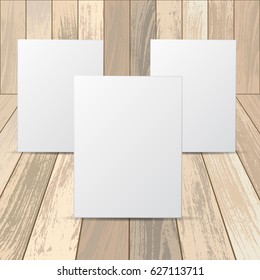 Set of three white frames with isolated on wooden background