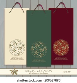 Set of three Wine Gift Bags on wood. Red, white & any wine or spirit present bag design. Autumn Leaf circle decorative banner. Vector is easily editable. Leaf pattern is masked. Golden Leaf icon. 