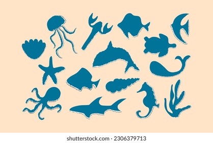 A set of torn blue paper with a white edge in the form of marine animals. Crumpled small pieces of colored ripped pages with damaged edges of various shapes and sizes.