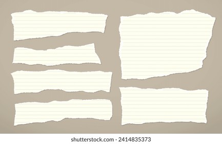 Set of torn, ripped lined paper strips with soft shadow are on light brown background for text or ad.