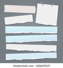 Set of torn white and blue note, notebook paper strips and pieces with soft shadow stuck on dark grey background. Vector illustration