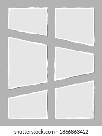 Set of torn white note. Scraps of torn paper of various shapes isolated on gray background. Vector illustration.