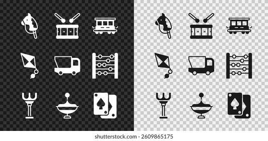 Set Toy horse, Drum with drum sticks, Passenger train cars toy, Rake, Whirligig, Playing cards, Kite and truck icon. Vector