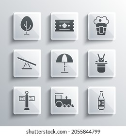 Set Toy train, Bottle of water, Magician hat and rabbit, Sun protective umbrella, Road traffic signpost, Seesaw, Tree and Popcorn box icon. Vector
