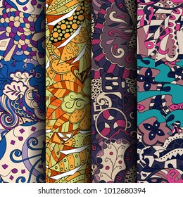 Set of tracery colorful seamless patterns. Vertical stripes. Curved doodling backgrounds for textile or printing with mehndi and ethnic motives. Vector
