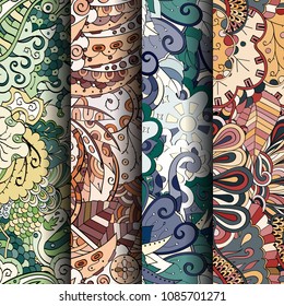 Set of tracery colorful seamless patterns. Vertical stripes. Curved doodling backgrounds for textile or printing with mehndi and ethnic motives. Vector