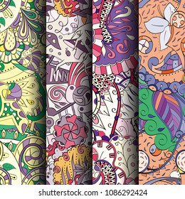 Set of tracery colorful seamless patterns. Vertical stripes. Curved doodling backgrounds for textile or printing with mehndi and ethnic motives. Vector