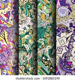 Set of tracery colorful seamless patterns. Vertical stripes. Curved doodling backgrounds for textile or printing with mehndi and ethnic motives. Vector