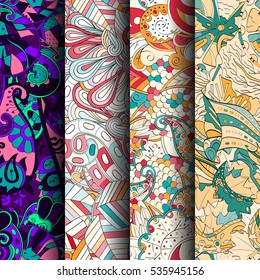 Set of tracery colorful seamless patterns. Curved doodling backgrounds for textile of printing with mehndi and ethnic motives. Vector.