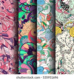 Set of tracery colorful seamless patterns. Curved doodling backgrounds for textile of printing with mehndi and ethnic motives. Vector.