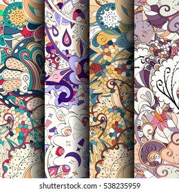 Set of tracery colorful seamless patterns. Curved doodling backgrounds for textile of printing with mehndi and ethnic motives. Vector.