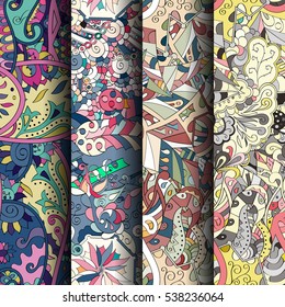 Set of tracery colorful seamless patterns. Curved doodling backgrounds for textile of printing with mehndi and ethnic motives. Vector.