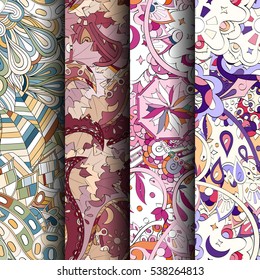 Set of tracery colorful seamless patterns. Curved doodling backgrounds for textile of printing with mehndi and ethnic motives. Vector.