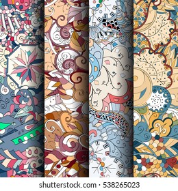 Set of tracery colorful seamless patterns. Curved doodling backgrounds for textile of printing with mehndi and ethnic motives. Vector.