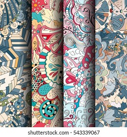 Set of tracery colorful seamless patterns. Curved doodling backgrounds for textile or printing with mehndi and ethnic motives. Vector.