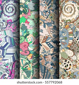 Set of tracery colorful seamless patterns. Curved doodling backgrounds for textile or printing with mehndi and ethnic motives. Vector.