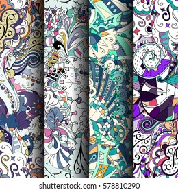 Set of tracery colorful seamless patterns. Curved doodling backgrounds for textile or printing with mehndi and ethnic motives. Vector.