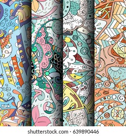 Set of tracery colorful seamless patterns. Vertical stripes. Curved doodling backgrounds for textile or printing with mehndi and ethnic motives. Vector