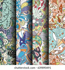 Set of tracery colorful seamless patterns. Vertical stripes. Curved doodling backgrounds for textile or printing with mehndi and ethnic motives. Vector
