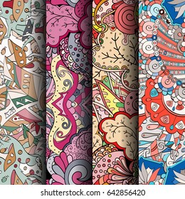 Set of tracery colorful seamless patterns. Vertical stripes. Curved doodling backgrounds for textile or printing with mehndi and ethnic motives. Vector