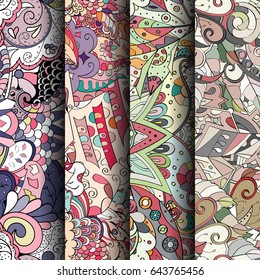 Set of tracery colorful seamless patterns. Vertical stripes. Curved doodling backgrounds for textile or printing with mehndi and ethnic motives. Vector