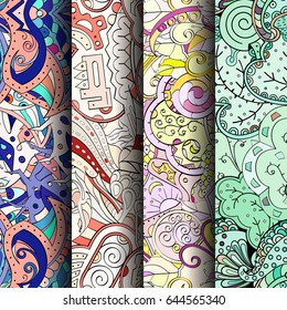 Set of tracery colorful seamless patterns. Vertical stripes. Curved doodling backgrounds for textile or printing with mehndi and ethnic motives. Vector