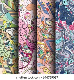 Set of tracery colorful seamless patterns. Vertical stripes. Curved doodling backgrounds for textile or printing with mehndi and ethnic motives. Vector
