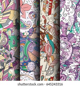 Set of tracery colorful seamless patterns. Vertical stripes. Curved doodling backgrounds for textile or printing with mehndi and ethnic motives. Vector