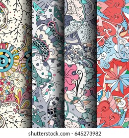 Set of tracery colorful seamless patterns. Vertical stripes. Curved doodling backgrounds for textile or printing with mehndi and ethnic motives. Vector