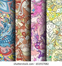 Set of tracery colorful seamless patterns. Vertical stripes. Curved doodling backgrounds for textile or printing with mehndi and ethnic motives. Vector