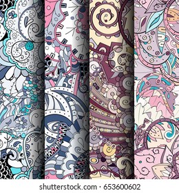 Set of tracery colorful seamless patterns. Vertical stripes. Curved doodling backgrounds for textile or printing with mehndi and ethnic motives. Vector
