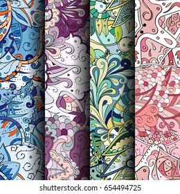 Set of tracery colorful seamless patterns. Vertical stripes. Curved doodling backgrounds for textile or printing with mehndi and ethnic motives. Vector