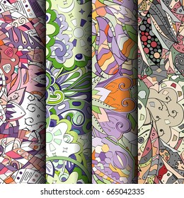 Set of tracery colorful seamless patterns. Vertical stripes. Curved doodling backgrounds for textile or printing with mehndi and ethnic motives. Vector