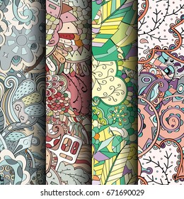 Set of tracery colorful seamless patterns. Vertical stripes. Curved doodling backgrounds for textile or printing with mehndi and ethnic motives. Vector