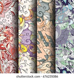Set of tracery colorful seamless patterns. Vertical stripes. Curved doodling backgrounds for textile or printing with mehndi and ethnic motives. Vector