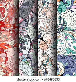 Set of tracery colorful seamless patterns. Vertical stripes. Curved doodling backgrounds for textile or printing with mehndi and ethnic motives. Vector