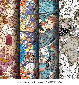 Set of tracery colorful seamless patterns. Vertical stripes. Curved doodling backgrounds for textile or printing with mehndi and ethnic motives. Vector