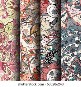 Set of tracery colorful seamless patterns. Vertical stripes. Curved doodling backgrounds for textile or printing with mehndi and ethnic motives. Vector