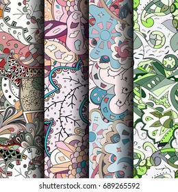 Set of tracery colorful seamless patterns. Vertical stripes. Curved doodling backgrounds for textile or printing with mehndi and ethnic motives. Vector