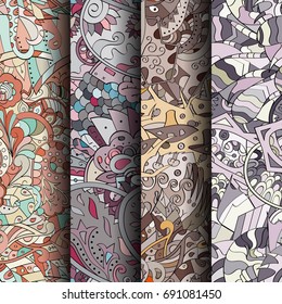 Set of tracery colorful seamless patterns. Vertical stripes. Curved doodling backgrounds for textile or printing with mehndi and ethnic motives. Vector