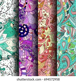 Set of tracery colorful seamless patterns. Vertical stripes. Curved doodling backgrounds for textile or printing with mehndi and ethnic motives. Vector