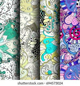 Set of tracery colorful seamless patterns. Vertical stripes. Curved doodling backgrounds for textile or printing with mehndi and ethnic motives. Vector