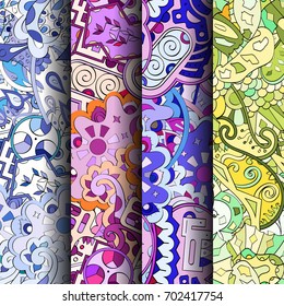 Set of tracery colorful seamless patterns. Vertical stripes. Curved doodling backgrounds for textile or printing with mehndi and ethnic motives. Vector