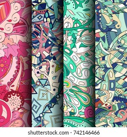 Set of tracery colorful seamless patterns. Vertical stripes. Curved doodling backgrounds for textile or printing with mehndi and ethnic motives. Vector