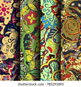Set of tracery colorful seamless patterns. Vertical stripes. Curved doodling backgrounds for textile or printing with mehndi and ethnic motives. Vector