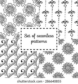 Set of traditional ethnic patterns in Indian style. Black and white branches, flowers and elements for textile, background or wrapping paper.