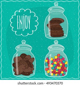 Set of transparent glass jars with sweets, such as colorful round candy or round chocolate cookies. Cyan background and ornate lettering Enjoy. Handmade cartoon style. Vector illustration