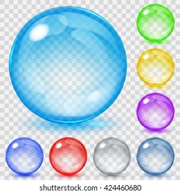 Set of transparent glass spheres of various colors with glares and shadows. Transparency only in vector file