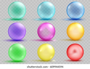 Set of transparent and opaque colored spheres with shadows and glares. Transparency only in vector file